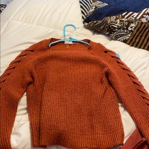 Long sleeve sweater with cut outs on the sleeves